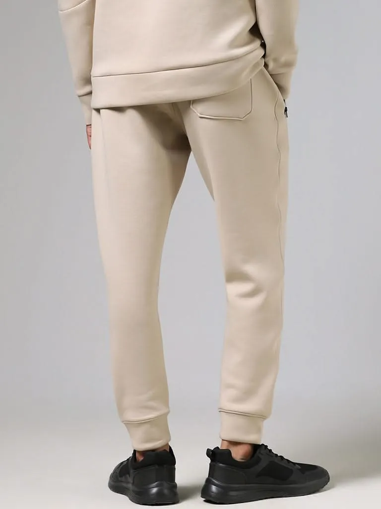 Studiofit Solid Beige Slim-Fit Mid-Rise Joggers