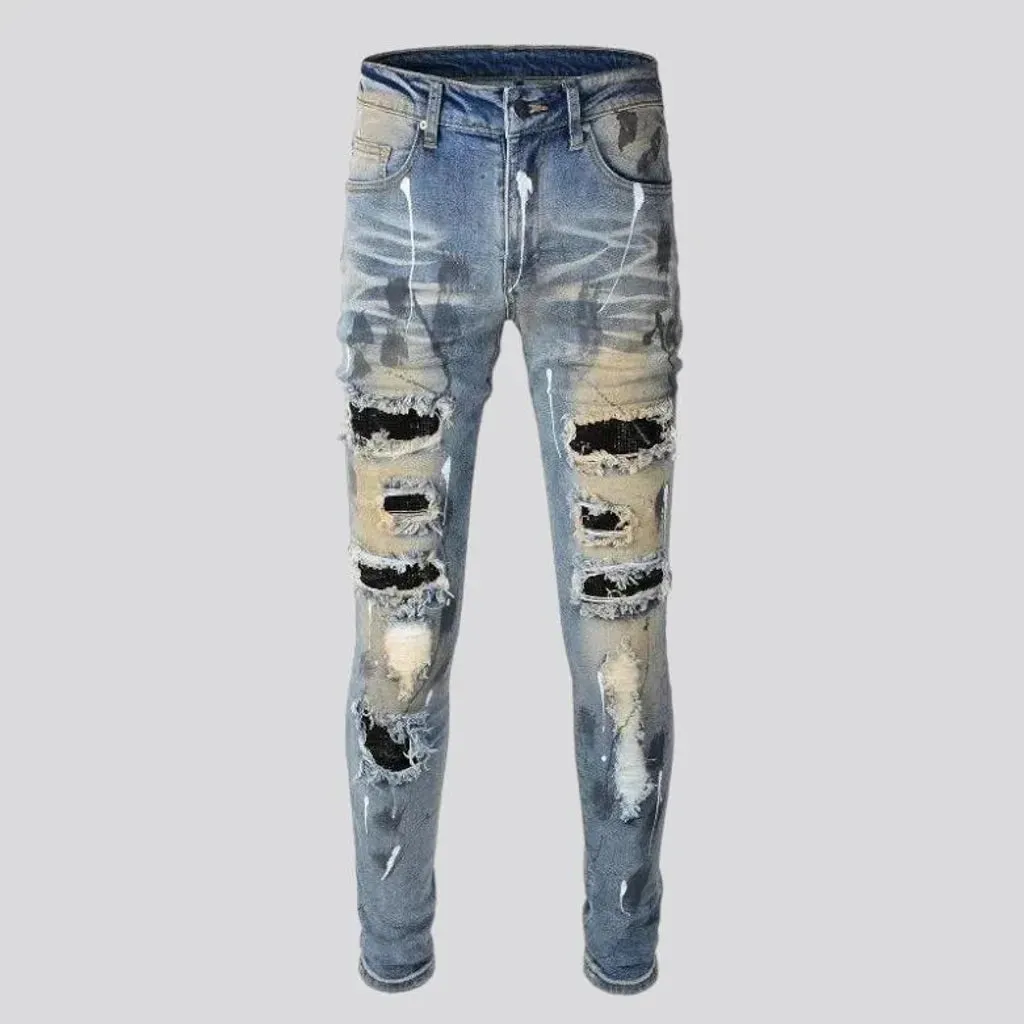 Whiskered crystal-patch jeans