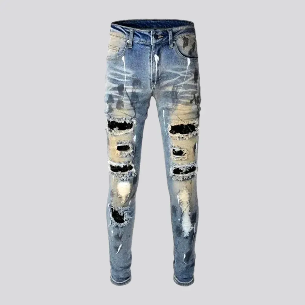 Whiskered crystal-patch jeans